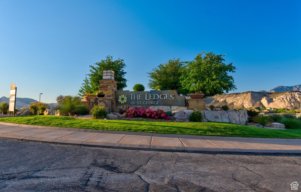 5013 Escapes Dr N Unit 303, St George, UT 84770 - community / neighborhood sign with a mountain view and a lawn