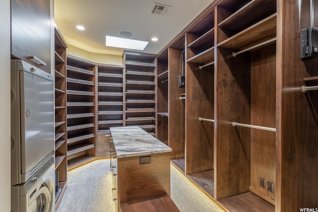 854 W Tawgoo Ct, Ivins, UT 84738 - spacious closet featuring a skylight, stacked washer and clothes dryer, and visible vents
