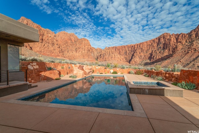 854 W Tawgoo Ct, Ivins, UT 84738 - view of pool featuring a fenced in pool, a patio area, a mountain view, and an in ground hot tub