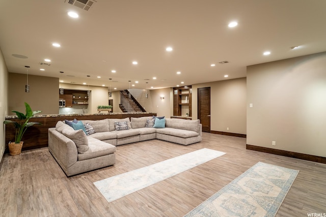 854 W Tawgoo Ct, Ivins, UT 84738 - living area with recessed lighting, visible vents, stairway, light wood-style floors, and baseboards