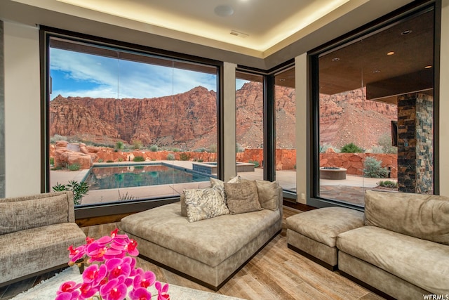 854 W Tawgoo Ct, Ivins, UT 84738 - living room featuring visible vents, wood finished floors, and a mountain view