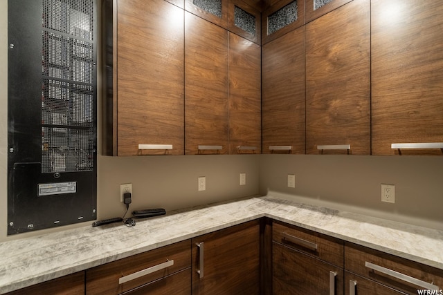 854 W Tawgoo Ct, Ivins, UT 84738 - kitchen featuring light stone counters, modern cabinets, and glass insert cabinets