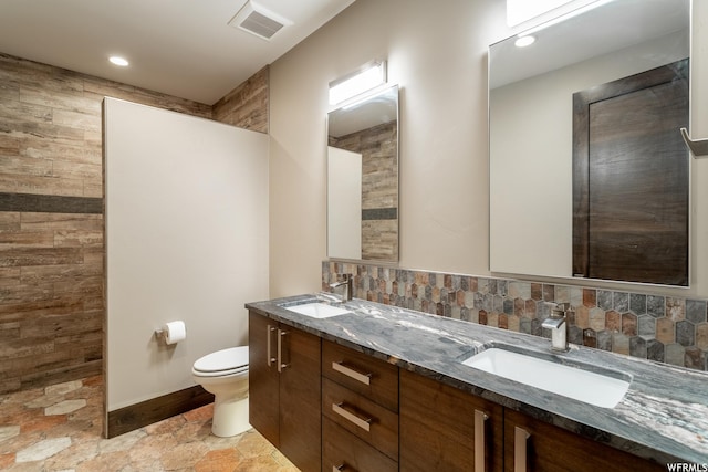 854 W Tawgoo Ct, Ivins, UT 84738 - bathroom featuring backsplash, a sink, and toilet