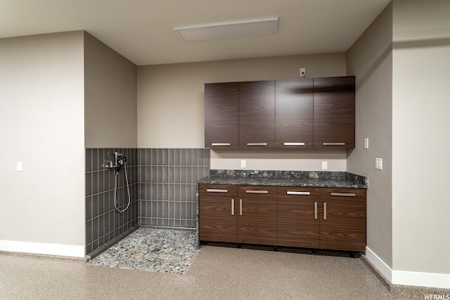 854 W Tawgoo Ct, Ivins, UT 84738 - interior space featuring dark stone countertops, modern cabinets, and baseboards