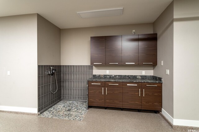 854 W Tawgoo Ct, Ivins, UT 84738 - interior space featuring modern cabinets, baseboards, and dark stone countertops