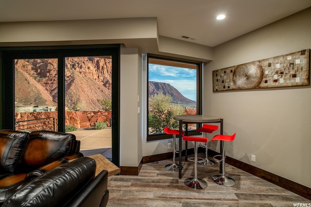 854 W Tawgoo Ct, Ivins, UT 84738 - dining area with baseboards, visible vents, a mountain view, and wood finished floors