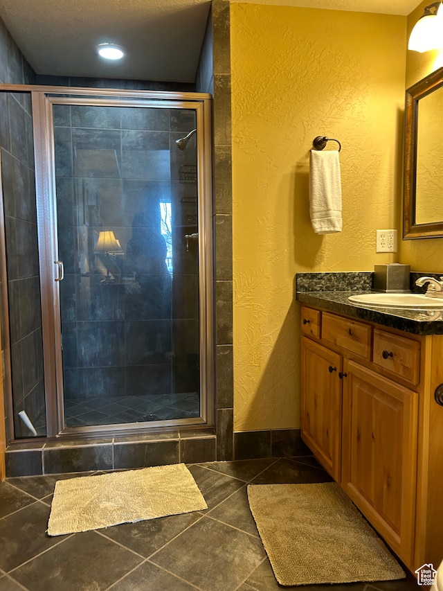 2653 Canyons Resort Dr Unit 126, Park City, UT 84098 - bathroom with tile patterned flooring, vanity, and walk in shower