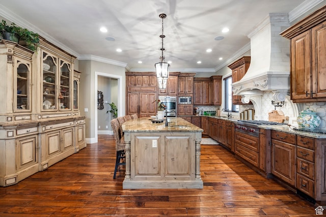 3626 E Granite Bench Ln S, Sandy, UT 84092 - kitchen with dark hardwood / wood-style flooring, a kitchen island with sink, light stone countertops, premium range hood, and a kitchen breakfast bar