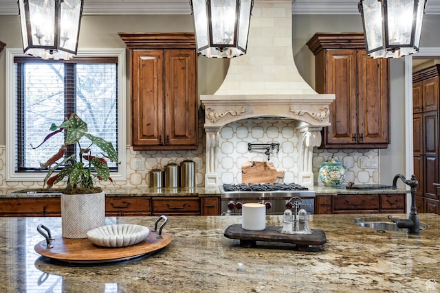 3626 E Granite Bench Ln S, Sandy, UT 84092 - kitchen with hanging light fixtures, a notable chandelier, sink, tasteful backsplash, and ornamental molding