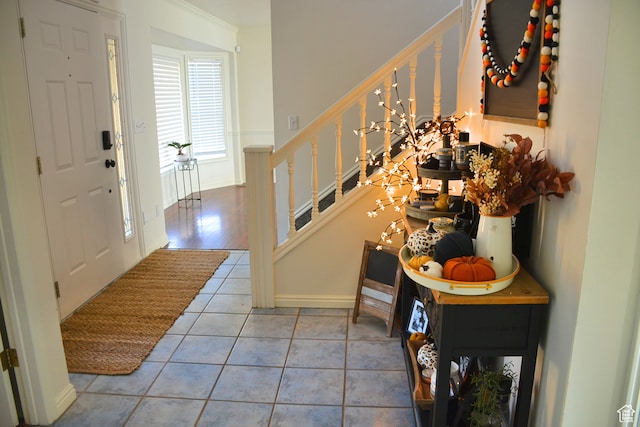 1605 Foxmore St, Pocatello, ID 83204 - tiled entrance foyer with an inviting chandelier and crown molding