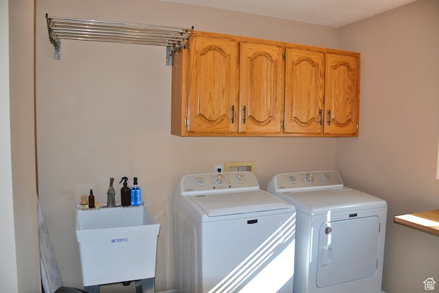 1605 Foxmore St, Pocatello, ID 83204 - clothes washing area featuring sink, cabinets, and washer and clothes dryer
