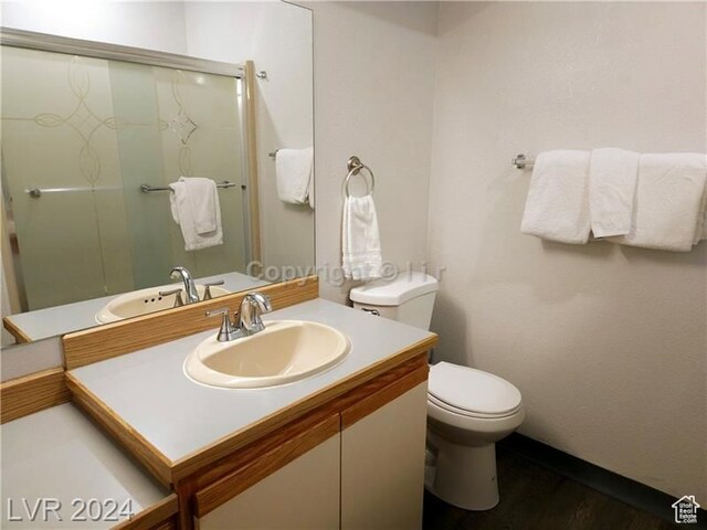 223 Hunter Ridge Rd Unit A202, Brian Head, UT 84719 - bathroom featuring toilet, a shower with shower door, and vanity