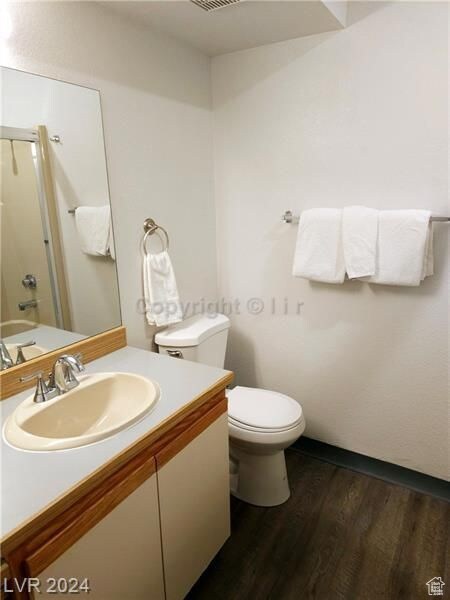 223 Hunter Ridge Rd Unit A202, Brian Head, UT 84719 - bathroom with hardwood / wood-style floors, vanity, and toilet