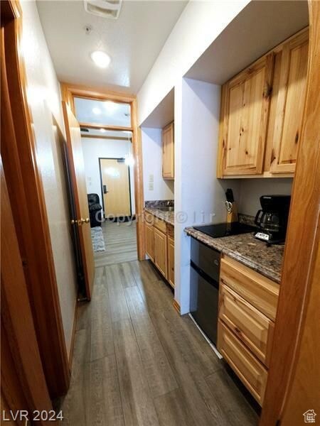 223 Hunter Ridge Rd Unit A202, Brian Head, UT 84719 - kitchen featuring light brown cabinets, dark stone counters, and dark hardwood / wood-style floors