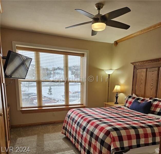 223 Hunter Ridge Rd Unit A202, Brian Head, UT 84719 - carpeted bedroom with ceiling fan