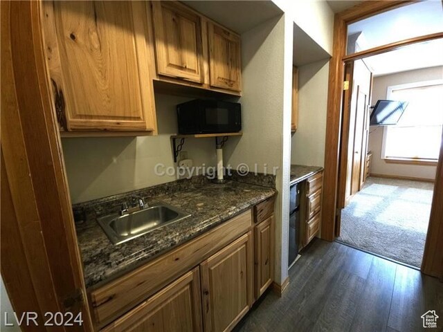 223 Hunter Ridge Rd Unit A202, Brian Head, UT 84719 - kitchen with dark stone counters, dark hardwood / wood-style flooring, and sink
