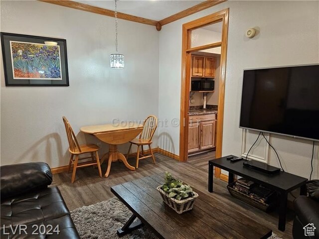 223 Hunter Ridge Rd Unit A202, Brian Head, UT 84719 - dining room with a notable chandelier, dark wood-type flooring, and crown molding