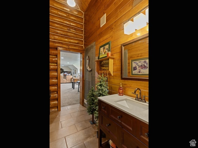 bathroom with large vanity and tile flooring