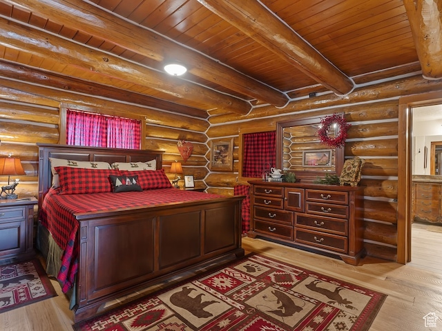 bedroom featuring rustic walls, wood ceiling, light wood-type flooring, and beam ceiling