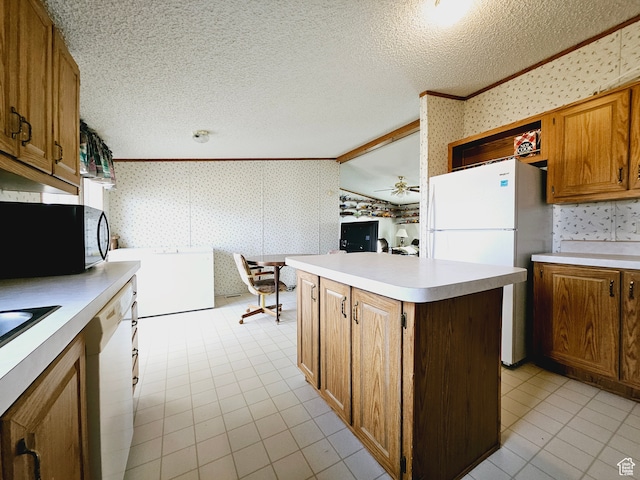 3628 E 3750 S, Ballard, UT 84066 - kitchen with a center island, white appliances, crown molding, vaulted ceiling, and ceiling fan