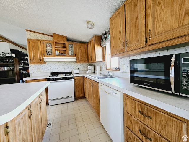 3628 E 3750 S, Ballard, UT 84066 - kitchen with a textured ceiling, sink, vaulted ceiling, and white appliances