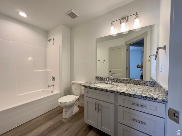 216 W Seasons Ln Unit 46, Garden City, UT 84028 - bathroom with wood finished floors, vanity, toilet, shower / tub combination, and baseboards