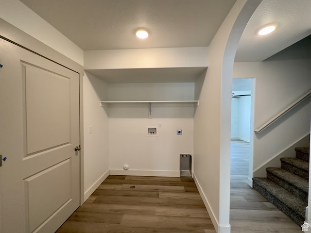 216 W Seasons Ln Unit 46, Garden City, UT 84028 - laundry room with hookup for an electric dryer, hookup for a washing machine, wood finished floors, and baseboards