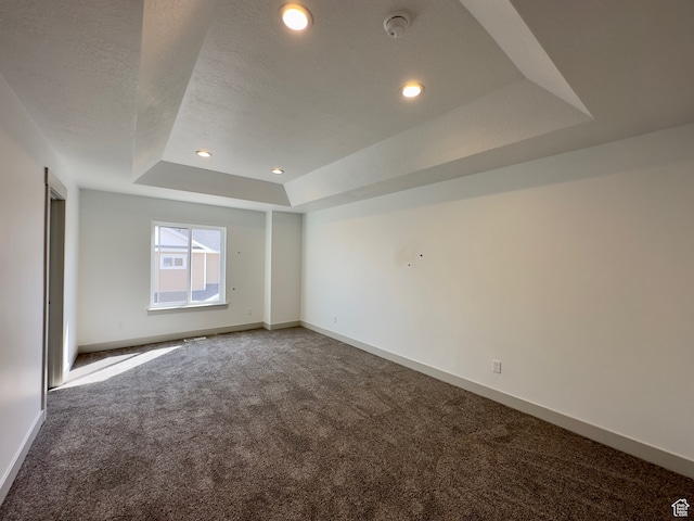 216 W Seasons Ln Unit 46, Garden City, UT 84028 - carpeted spare room featuring a raised ceiling, baseboards, recessed lighting, a smoke detector, and a textured ceiling