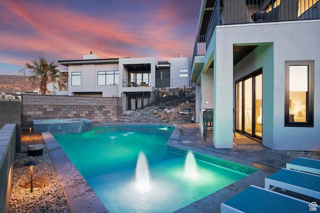 1560 W Torrey Pines Rd, Hurricane, UT 84737 - pool at dusk with pool water feature