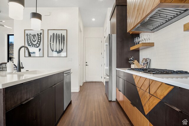 1560 W Torrey Pines Rd, Hurricane, UT 84737 - kitchen with custom range hood, hanging light fixtures, tasteful backsplash, sink, and dark hardwood / wood-style floors