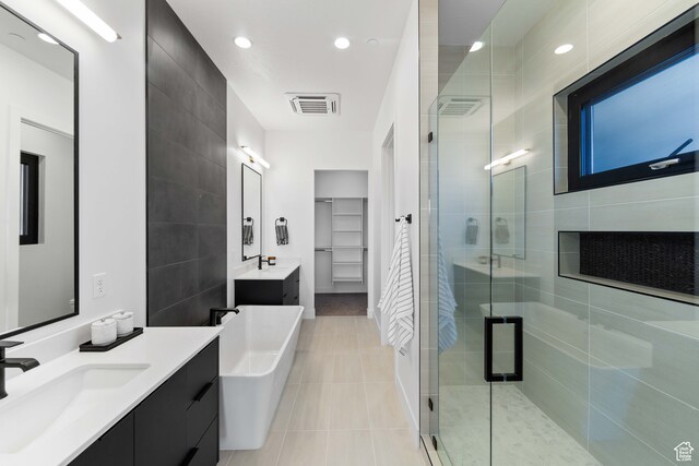 1560 W Torrey Pines Rd, Hurricane, UT 84737 - bathroom with tile floors, tile walls, vanity, and independent shower and bath