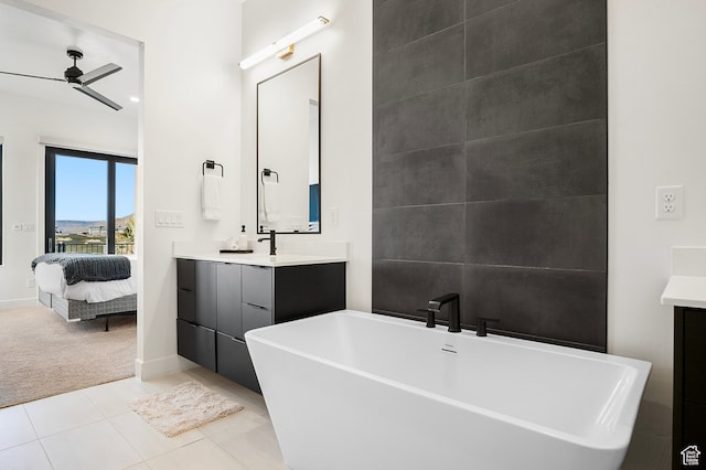 1560 W Torrey Pines Rd, Hurricane, UT 84737 - bathroom featuring ceiling fan, tile floors, a bathing tub, and vanity with extensive cabinet space