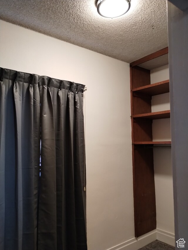 182 E 9000 S, Sandy, UT 84070 - bathroom featuring built in features and a textured ceiling
