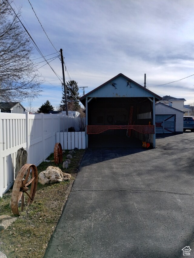 182 E 9000 S, Sandy, UT 84070 - garage featuring a carport