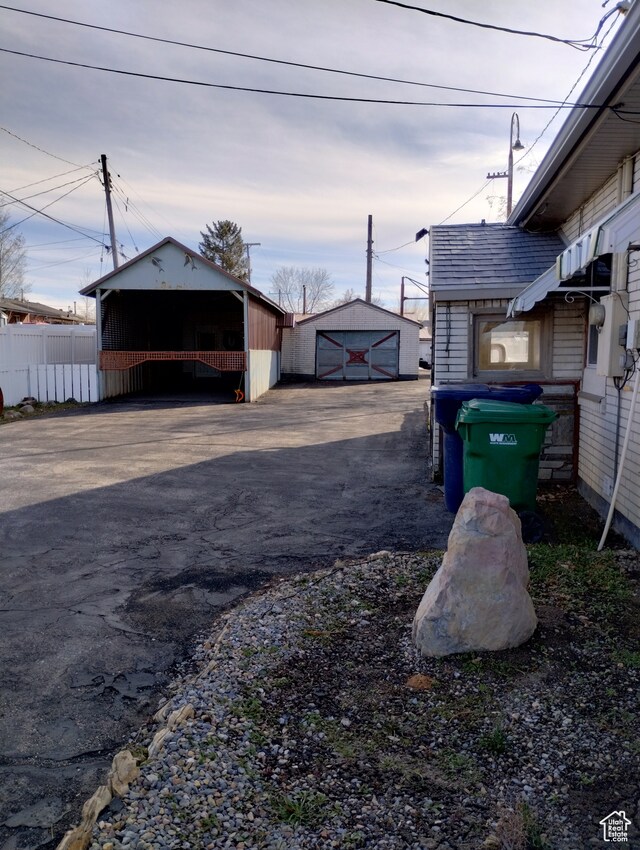 182 E 9000 S, Sandy, UT 84070 - view of yard with an outdoor structure and a garage