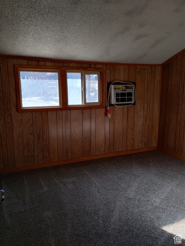 182 E 9000 S, Sandy, UT 84070 - carpeted spare room with wooden walls, a wall mounted air conditioner, and a textured ceiling