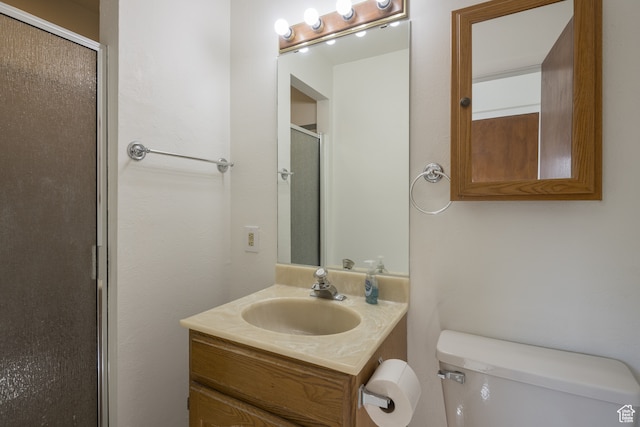 491 Mountain View Dr, Moab, UT 84532 - bathroom with vanity, toilet, and a shower with door