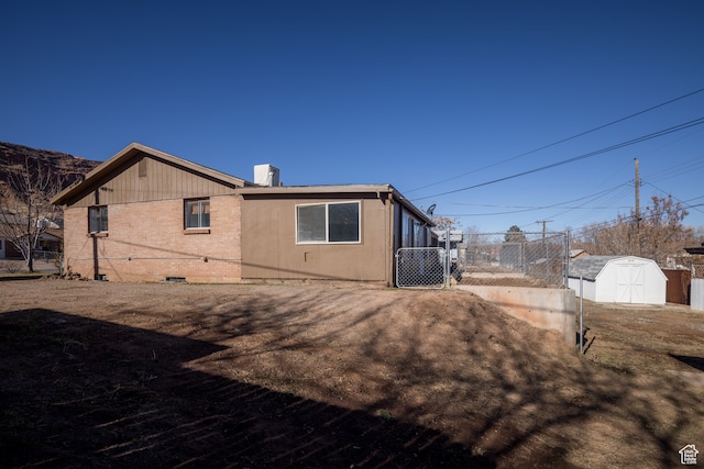 491 Mountain View Dr, Moab, UT 84532 - rear view of property featuring a storage shed