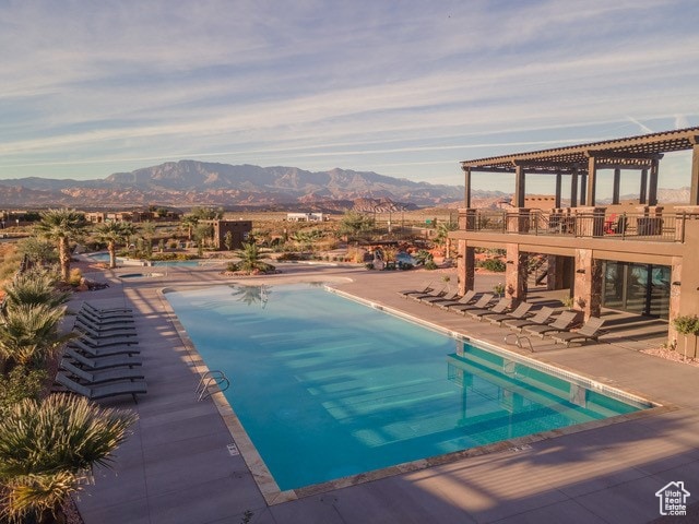 3209 S Dyami Vw Unit 11, Hurricane, UT 84737 - view of pool featuring a pergola, a mountain view, and a patio