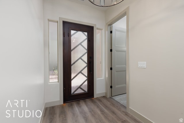 3209 S Dyami Vw Unit 11, Hurricane, UT 84737 - entrance foyer featuring light hardwood / wood-style flooring and an inviting chandelier