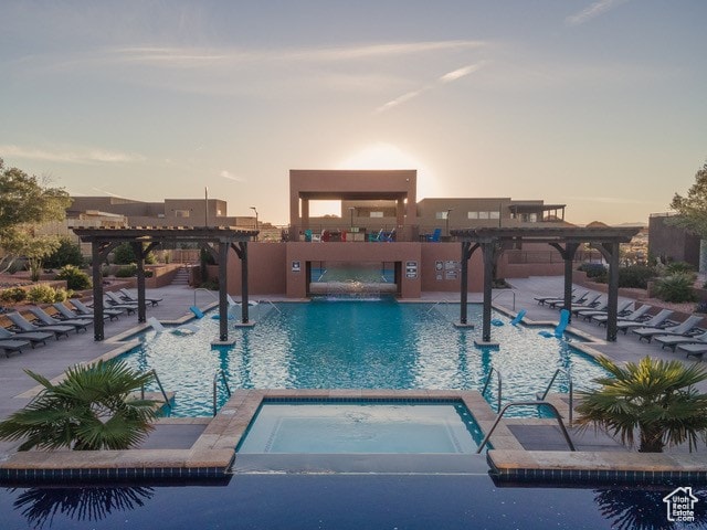 3209 S Dyami Vw Unit 11, Hurricane, UT 84737 - pool at dusk with a pergola, a patio area, and a community hot tub
