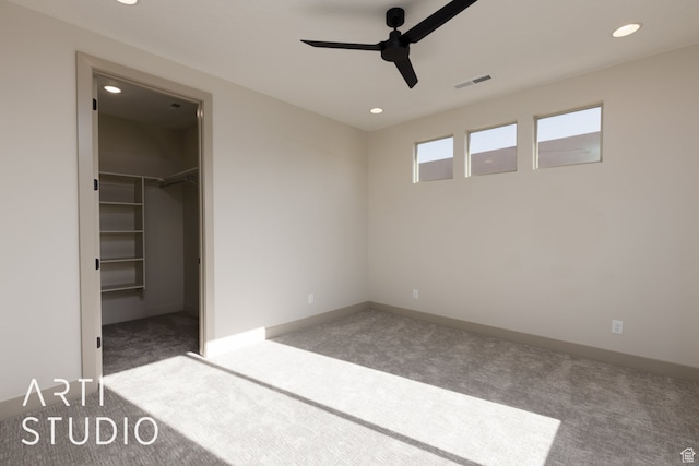 3209 S Dyami Vw Unit 11, Hurricane, UT 84737 - unfurnished bedroom featuring ceiling fan, a spacious closet, a closet, and dark colored carpet