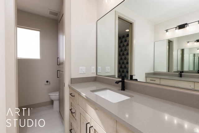 3209 S Dyami Vw Unit 11, Hurricane, UT 84737 - bathroom with tile floors, large vanity, and toilet