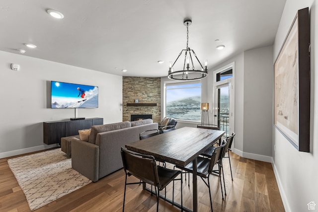 909 W Peace Tree Trl Unit 507, Heber City, UT 84032 - dining room featuring a notable chandelier, a stone fireplace, and dark wood-type flooring