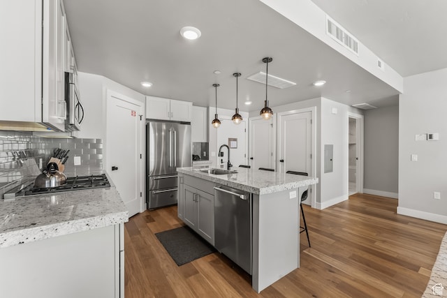 909 W Peace Tree Trl Unit 507, Heber City, UT 84032 - kitchen featuring backsplash, dark hardwood / wood-style floors, sink, stainless steel appliances, and pendant lighting