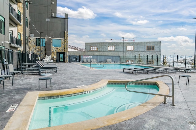 909 W Peace Tree Trl Unit 507, Heber City, UT 84032 - view of swimming pool featuring a community hot tub and a patio