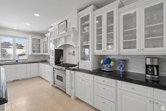 380 S Lindsay Spring Rd, Heber City, UT 84032 - kitchen with high end range, sink, light tile patterned floors, and white cabinets