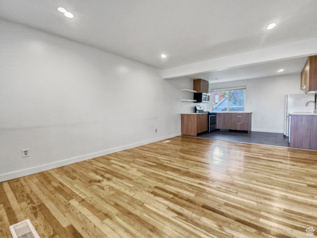 650 N 300 W Unit 218, Salt Lake City, UT 84103 - unfurnished living room featuring wood-type flooring