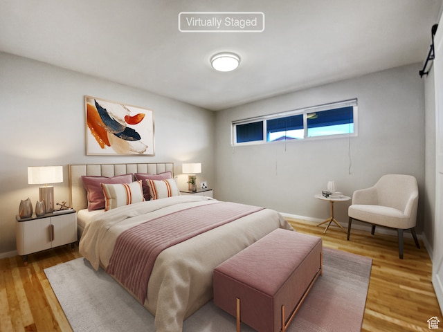 650 N 300 W Unit 218, Salt Lake City, UT 84103 - bedroom featuring light hardwood / wood-style floors