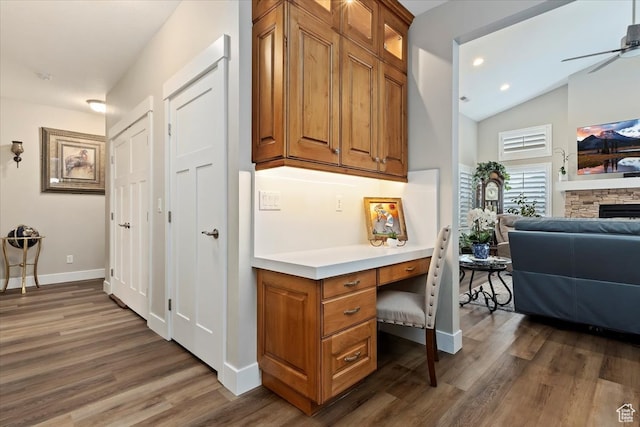 interior space with dark hardwood / wood-style floors and vaulted ceiling